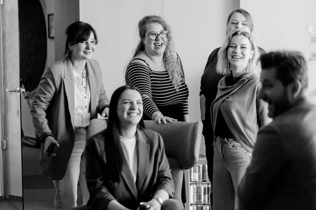 The team laughing together in the office