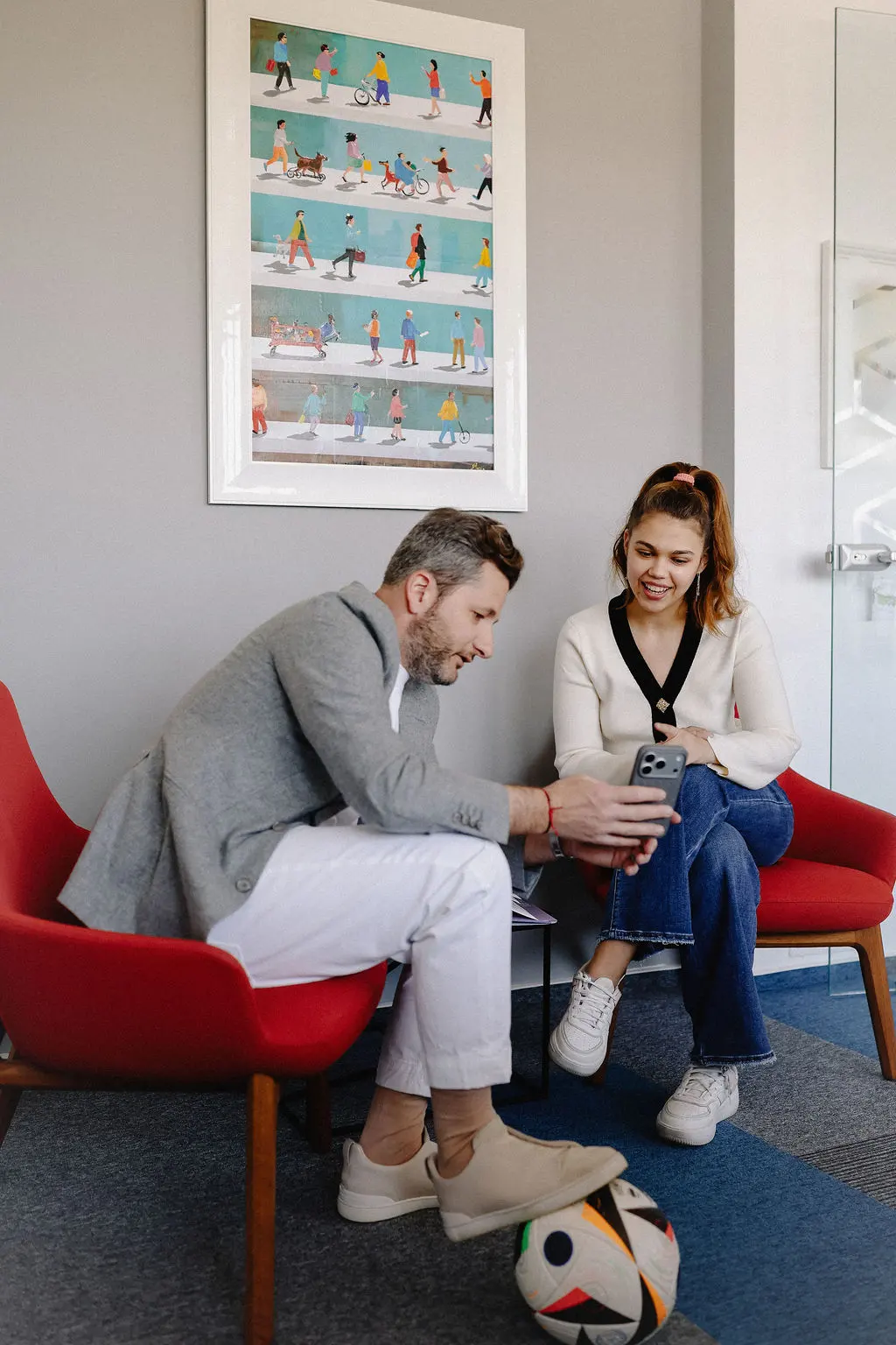 Two colleagues talking in the lounge