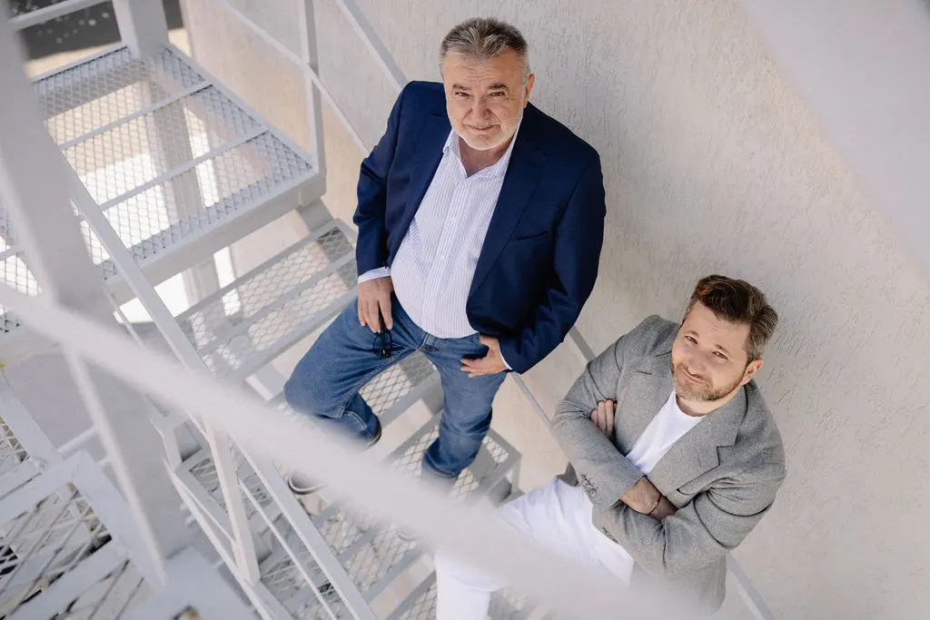 Two colleagues on the office stairs